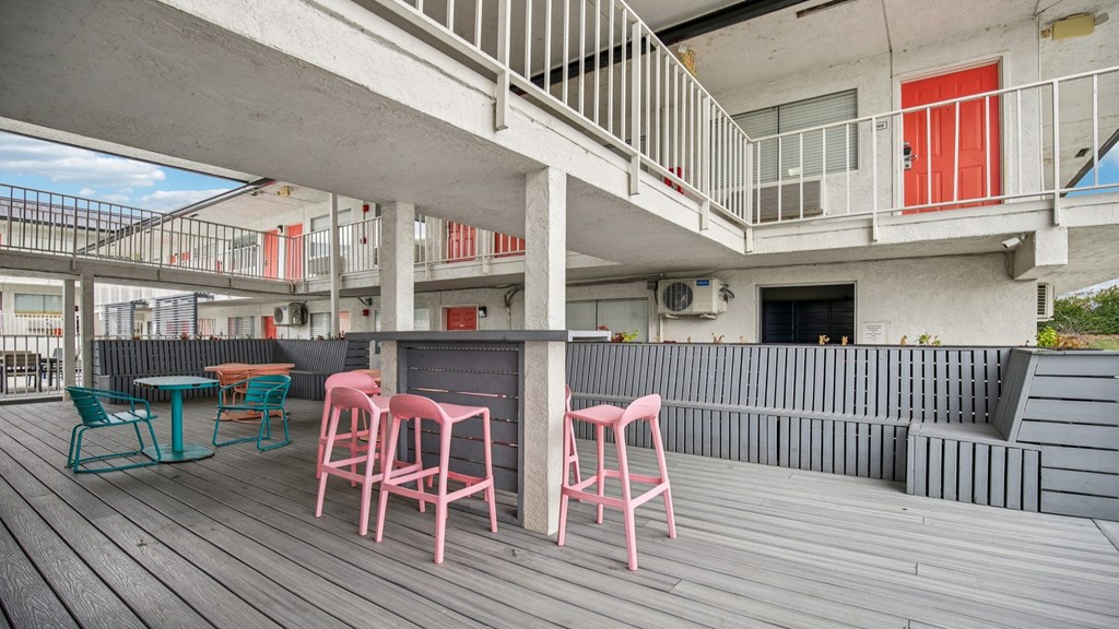 A patio with a table and chairs.