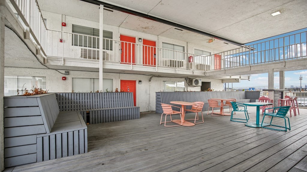 A patio area with a table and chairs.