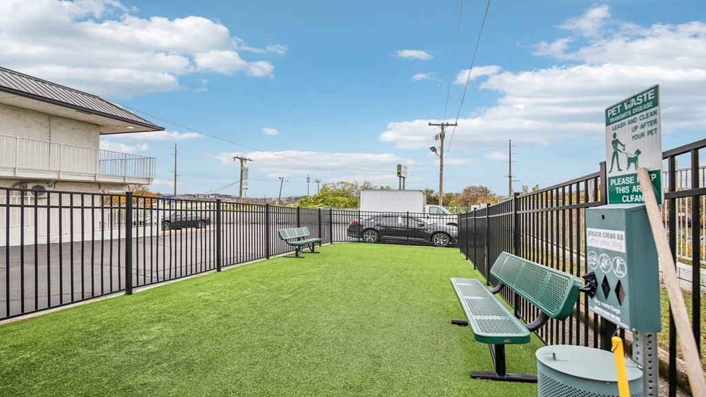 A sign on a fence reads