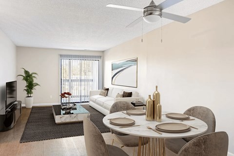 A modern living room with a dining table set for two.