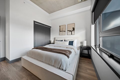 A bedroom with a large bed and a window at Damask, Ontario