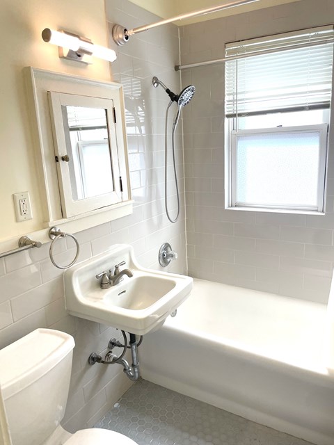 Updated bathroom with new tile and fixtures.