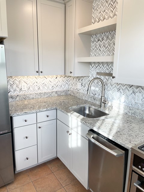 Sunny, south-facing eat-in kitchen full of windows.
