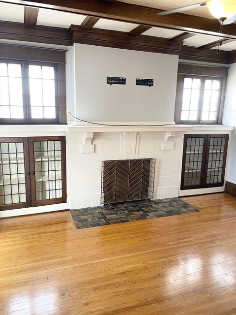 Hardwood floors throughout, elegant coffered ceilings.