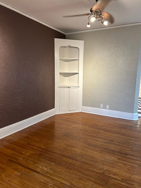 A room with a brown wall and a white door.