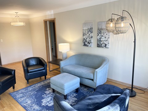 Warm hardwood flooring, coved plaster ceilings.