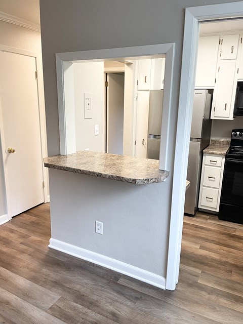 Pass-through opens the kitchen to the living area.
