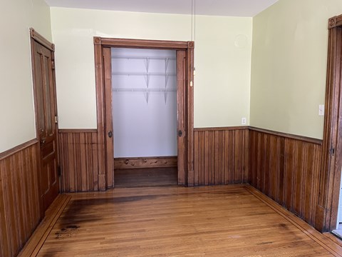 Original hardwood floors and oak wainscoting.