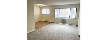 A room with a window and a door.