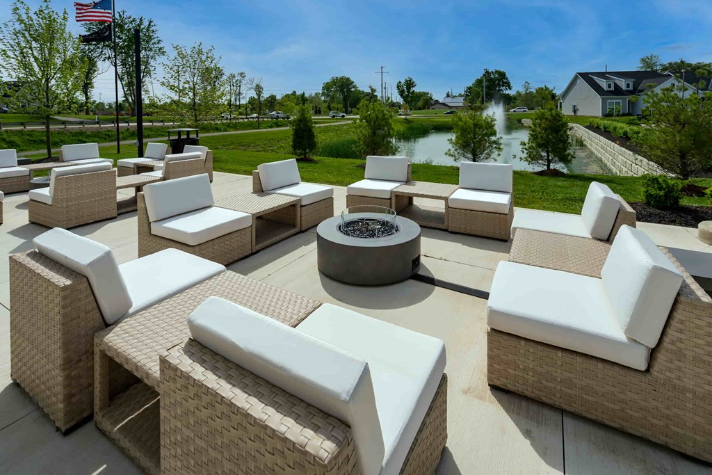 A large outdoor furniture set is arranged on a patio.