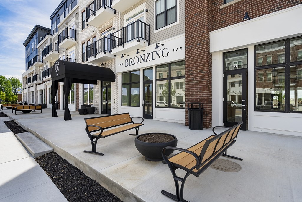 A street view of a building with a sign that says "Bronzing Bar".