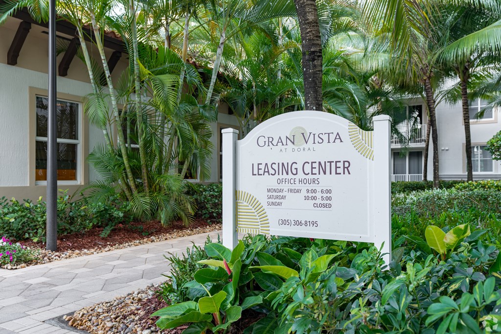A sign for the Gran Vista Leasing Center at the corner of a landscaped area.