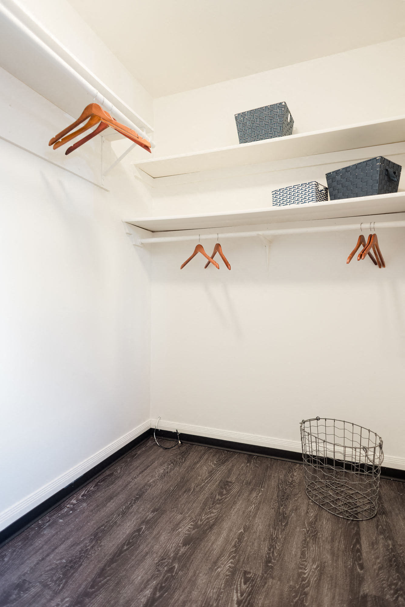 large walk-in closet with shelving at multiple heights