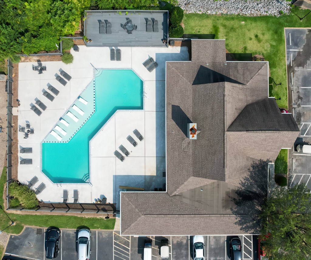 A large building with a pool in the middle of it.