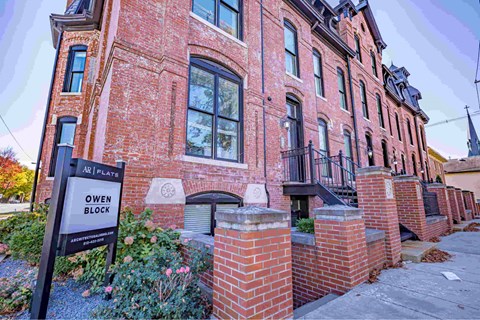 A red brick building with a sign that says "Owen Block".