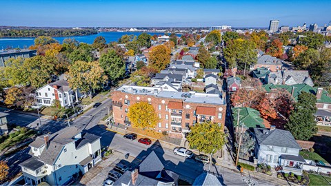 A small town with a large body of water in the background.