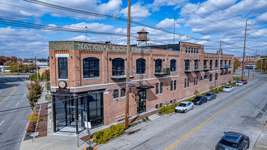 A National Bank building with a green sign on the top.