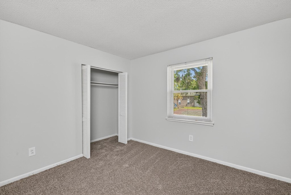 A room with a window and a door at Brackenbrook Apartments, North Charleston 29418