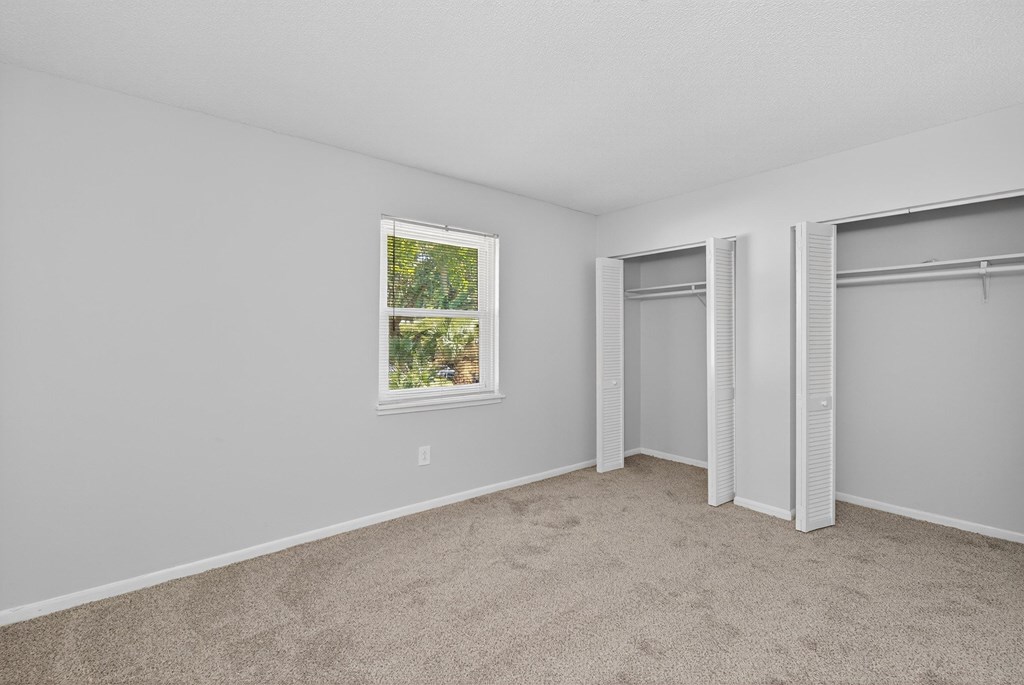 A room with a window and a door at Brackenbrook Apartments, North Charleston
