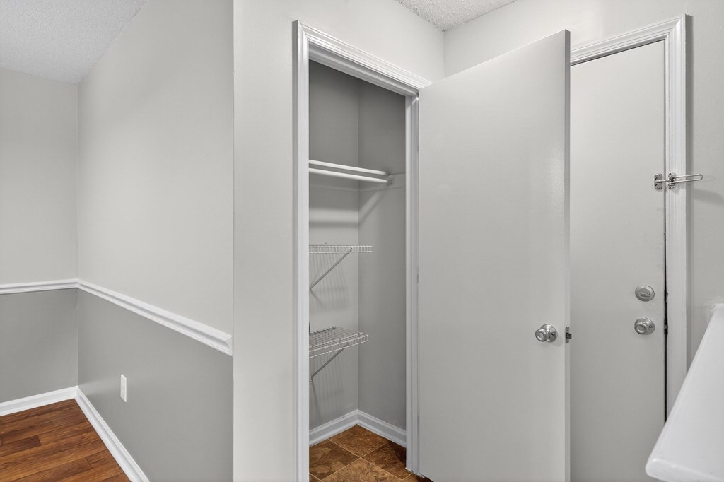 A white door with a glass window is open at North Bluff Apartments, South Carolina