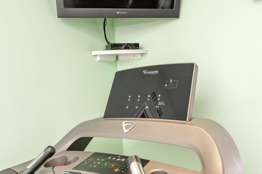A treadmill with a control panel on top of it at Sawbranch Apartments, South Carolina