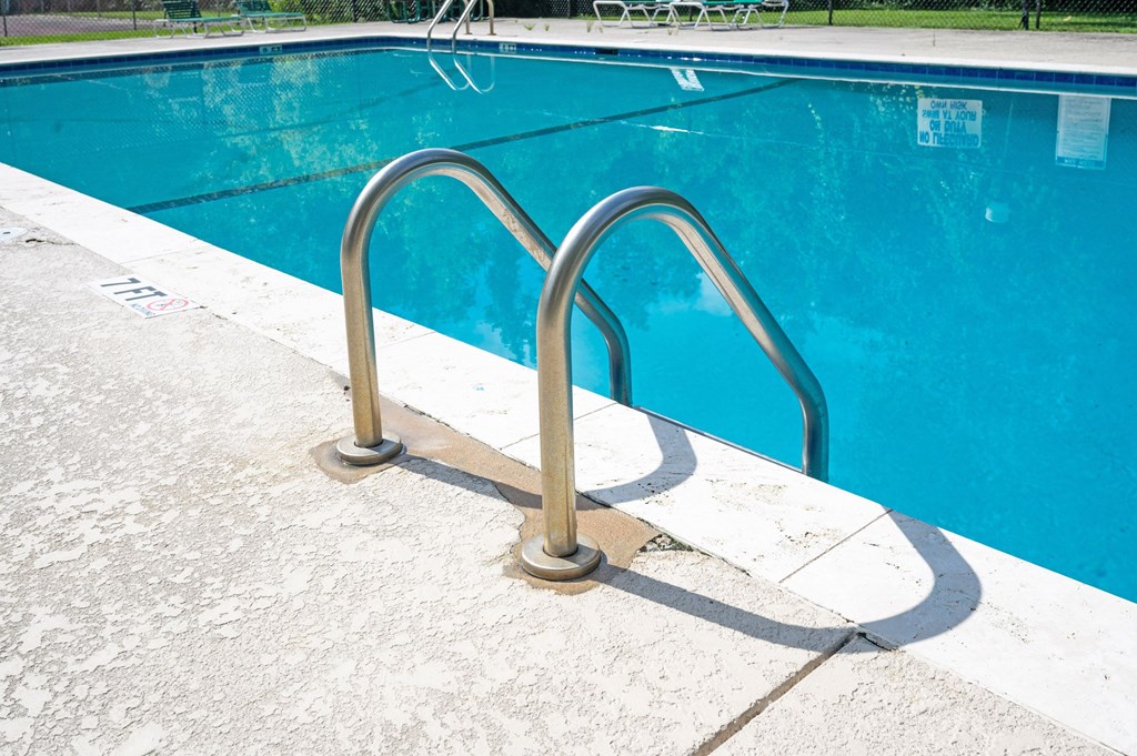 A pool with a metal ladder at Sawbranch Apartments, South Carolina