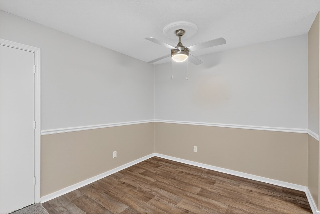 A room with a ceiling fan and light fixture at Sawbranch Apartments, Summerville 29485