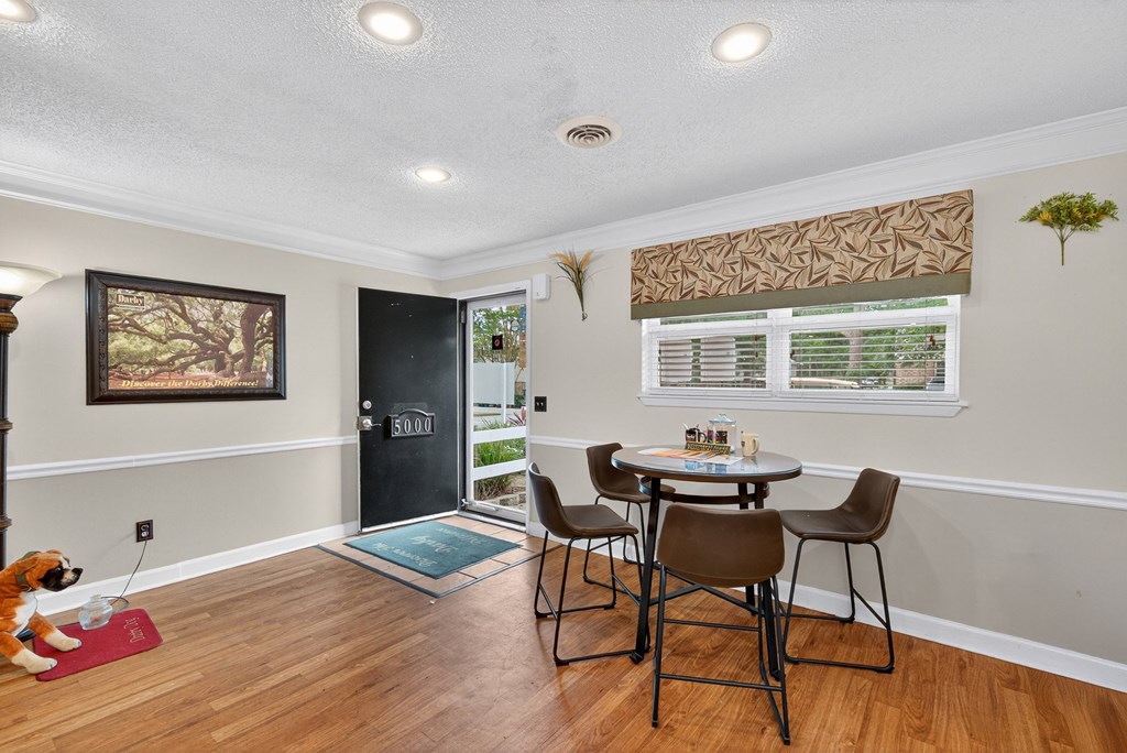 A dining room with a table and chairs. at The Landing Townhomes Apartments, Hanahan, SC, 29410