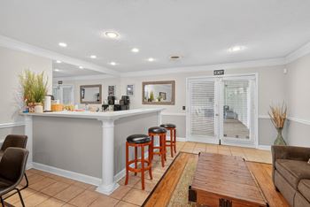 A bar area with a chair and a table at The Landing Townhomes Apartments, South Carolina, 29410