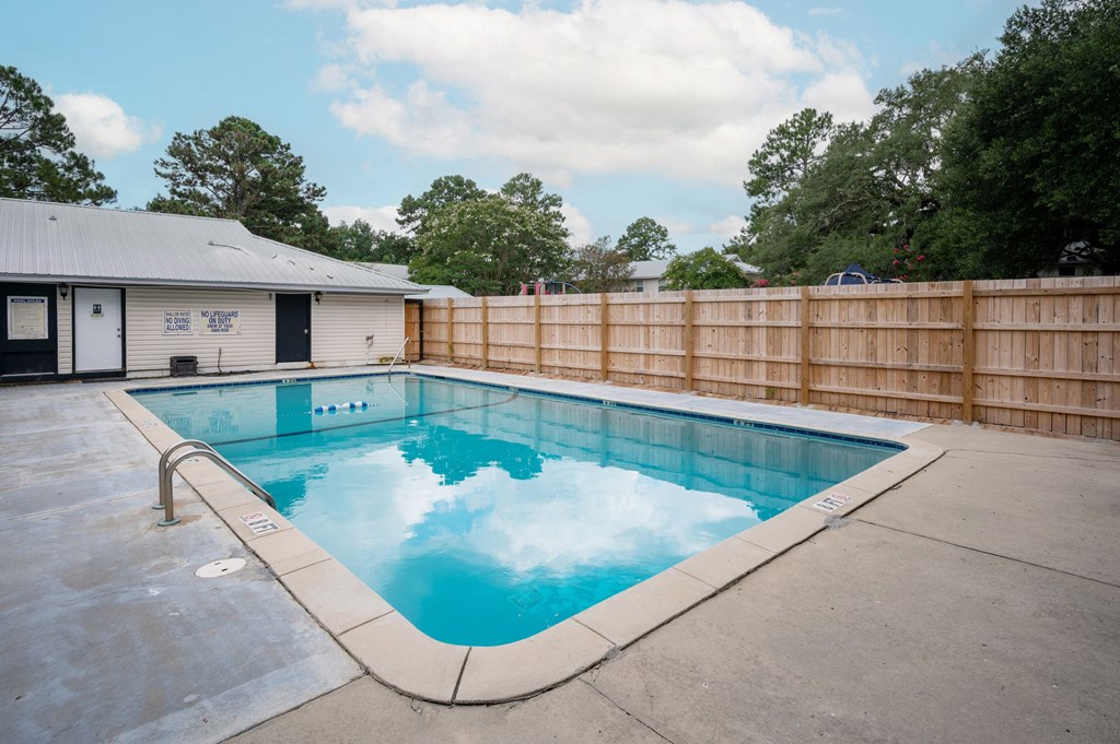 A small pool with a wooden fence around it at The Landing Townhomes Apartments, South Carolina, 29410