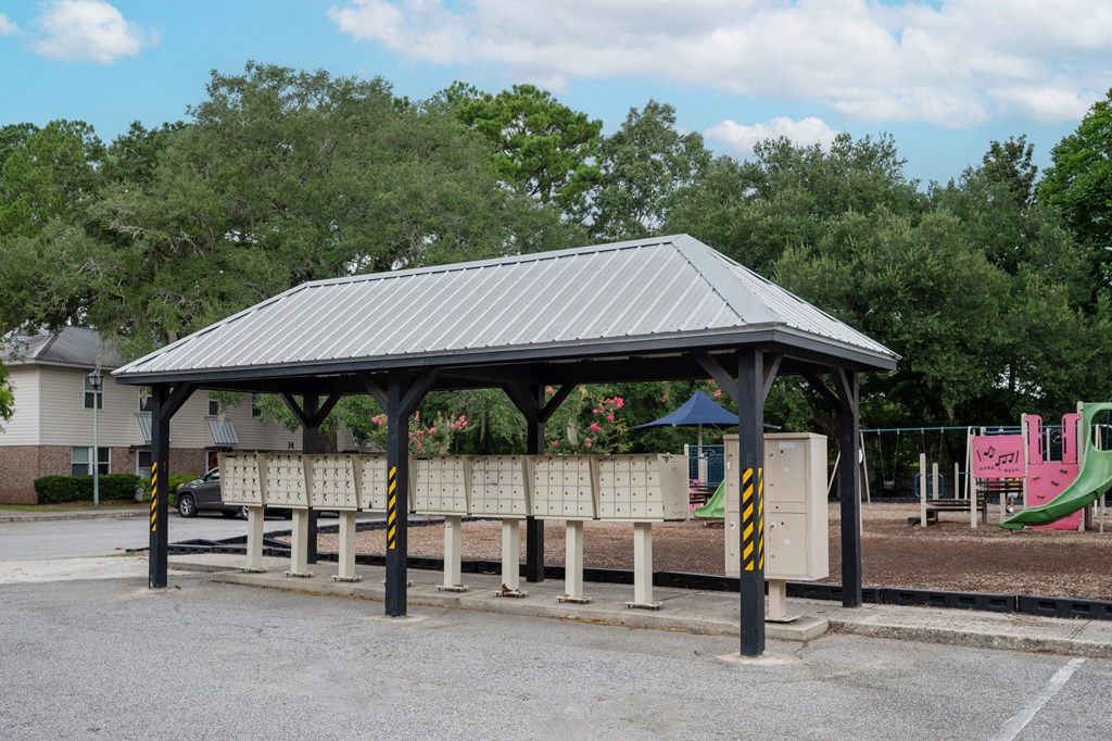 A covered bench area in a park at The Landing Townhomes Apartments, South Carolina