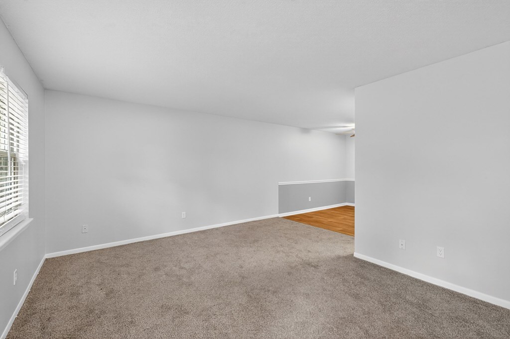 A room with white walls and a carpeted floor at The Landing Townhomes Apartments, Hanahan 29410