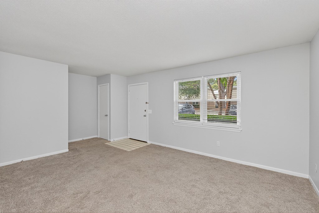 A room with white walls and a carpeted floor at The Landing Townhomes Apartments, Hanahan, South Carolina