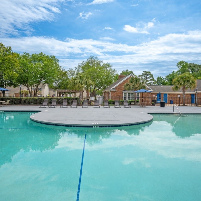 A swimming pool with a blue rope in the middle of it at The Preserve at Pine Valley Apartments, Wilmington, NC