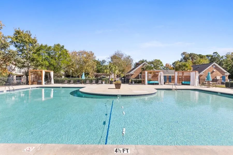 A large swimming pool with a depth marker at 4 feet.