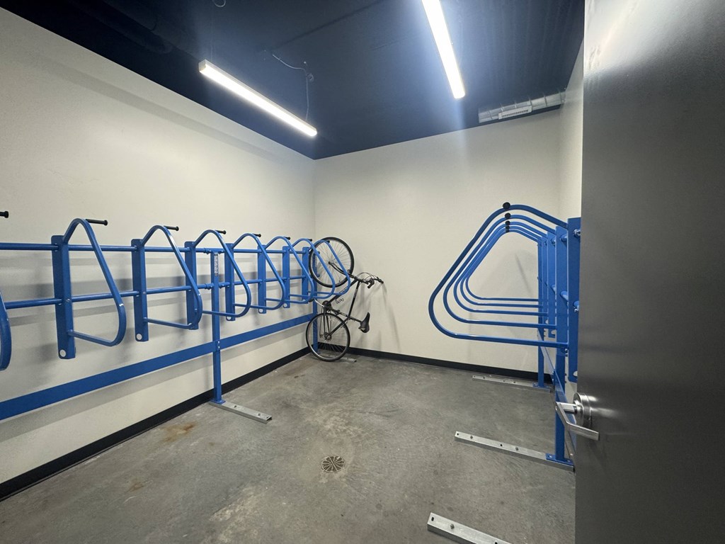 A bike is parked in a bike rack.