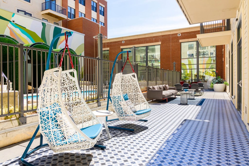 A patio with two chairs and a table.at The Vale at the Parks, Washington, DC  