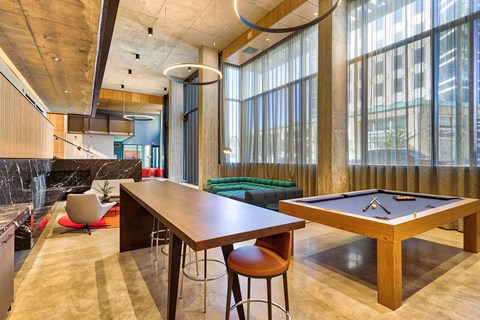 A room with a pool table and a bar area. A room with a pool table and a bar area.at Eleven Fifty Clay Street, California