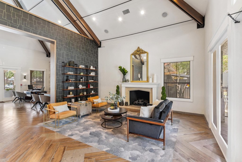 A living room with a fireplace and a mirror on the wall. A living room with a fireplace and a mirror on the wall.at Onyx183, Austin, 78729