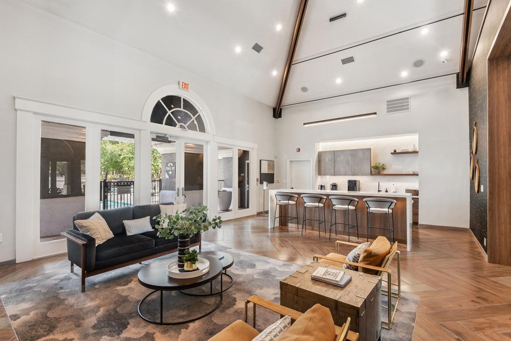 A living room with a black couch and a coffee table. A living room with a black couch and a coffee table.at Onyx183, Austin Texas