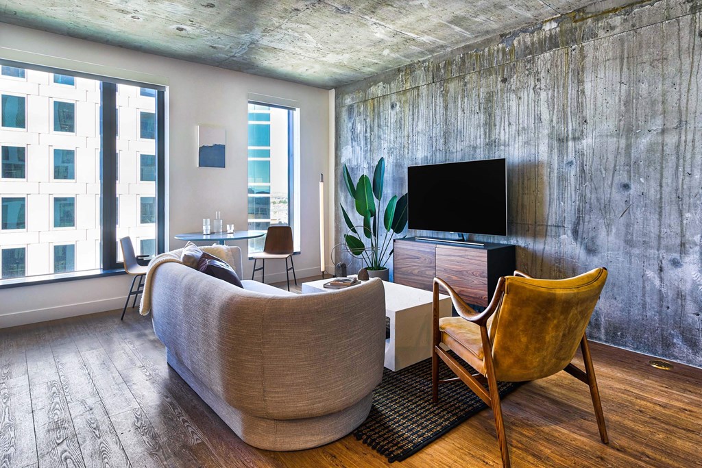 A living room with a couch, chair, and television.at Eleven Fifty Clay Street, Oakland, 94607  