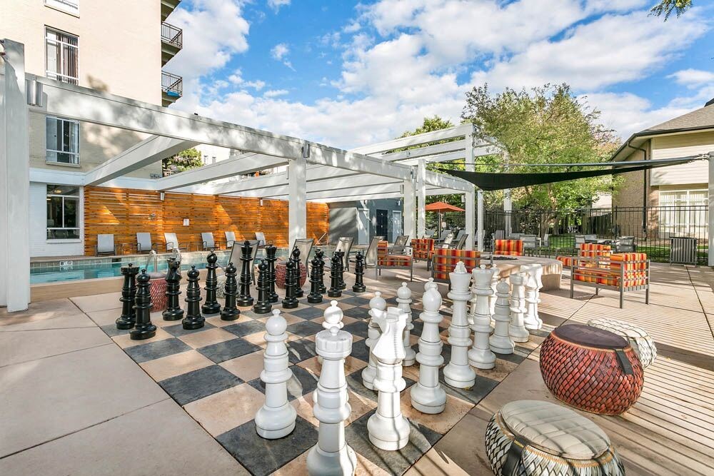 A giant chess set is set up on a patio. at The Lex At Lowry, Denver, CO, 80224