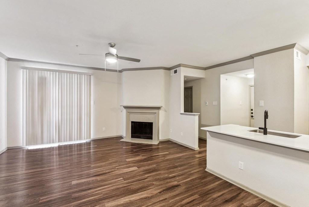 A spacious living room with a fireplace and a bar area. A spacious living room with a fireplace and a bar area.at Onyx183, Austin, 78729