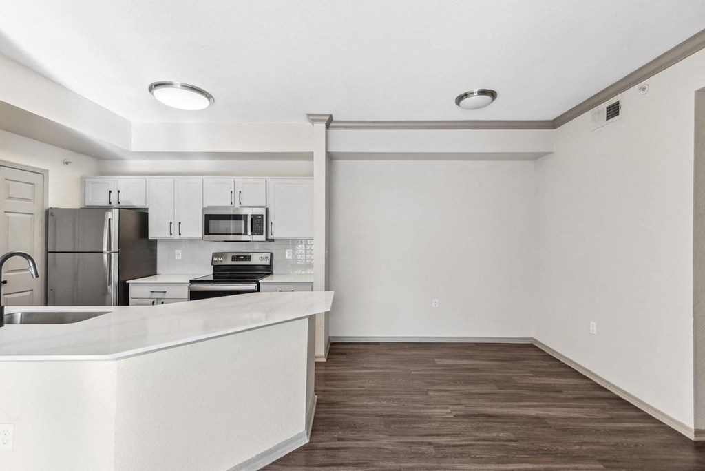 A kitchen with white countertops and stainless steel appliances. A kitchen with white countertops and stainless steel appliances.at Onyx183, Texas