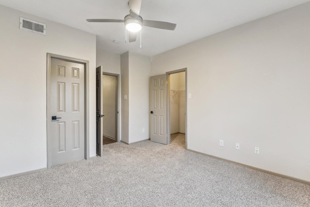 A room with a ceiling fan and three doors. A room with a ceiling fan and three doors.at Onyx183, Texas, 78729