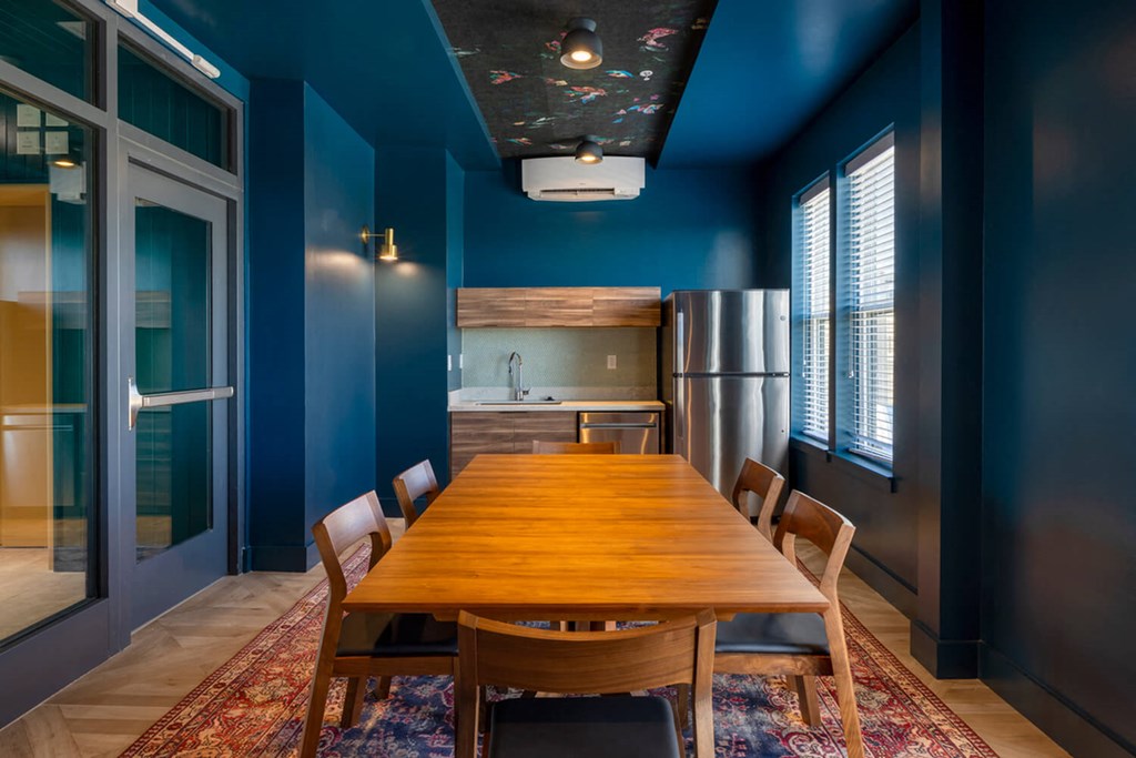 A dining room with a wooden table and chairs.at The Vale at the Parks, District of Columbia  