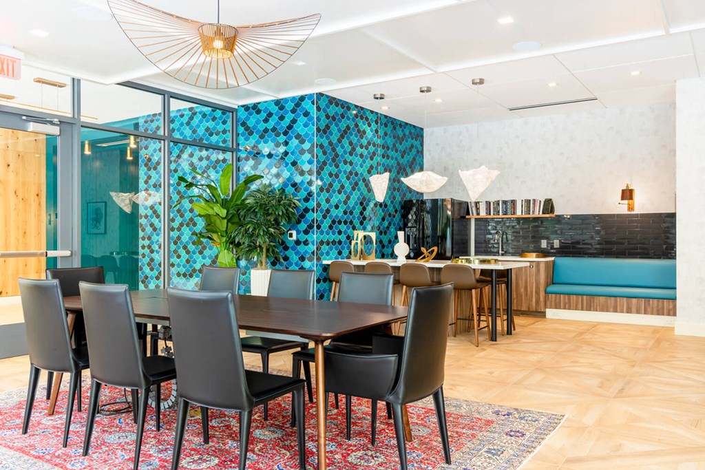 A dining room with a table set for six with chairs around it. A dining room with a table set for six with chairs around it.at The Vale at the Parks, Washington