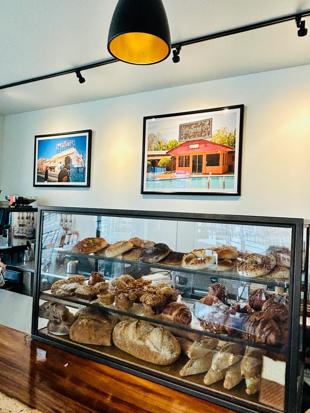 A bakery display case filled with various baked goods.