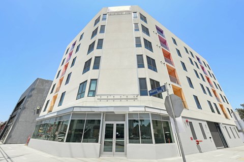 A white building with a blue sky in the background.