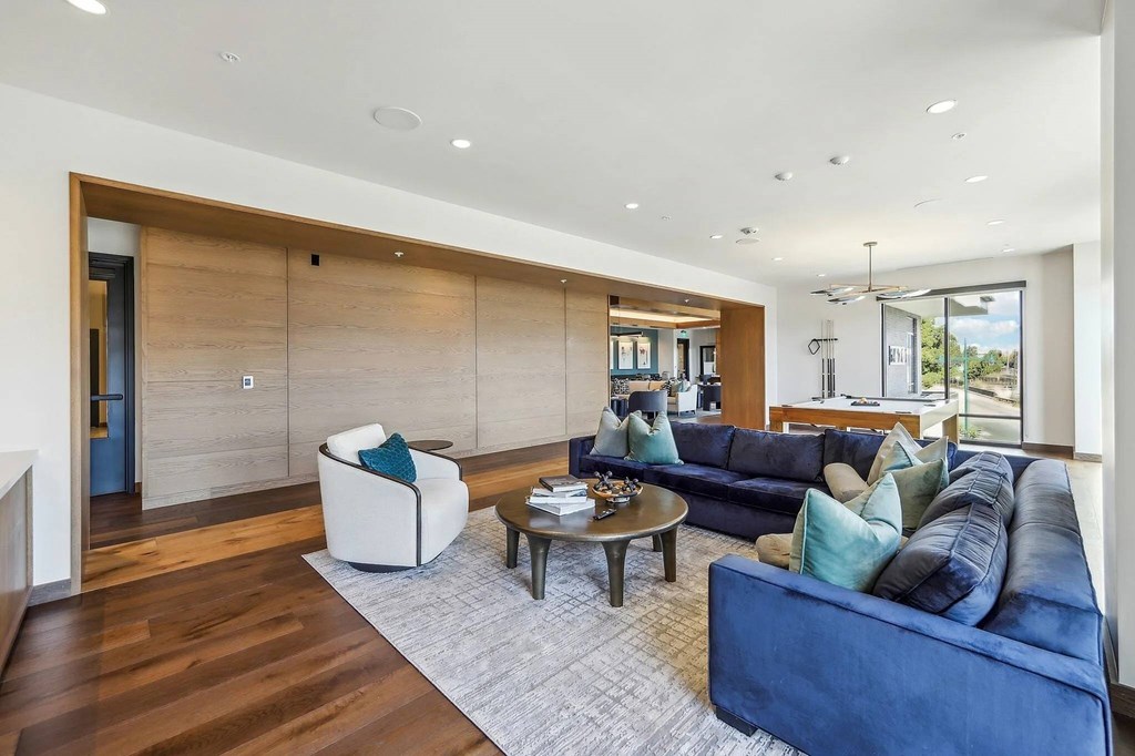 Living room with pool table at Bayview Apartments, California